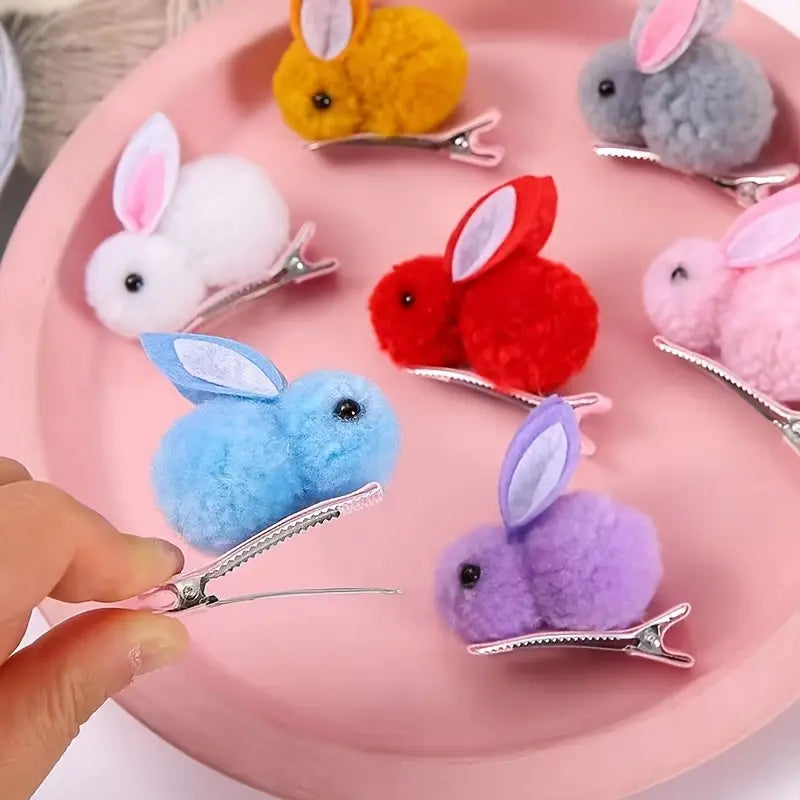 4 Small Easter Bunny Gifts And Accessories, Including Headbands And Hair Clips in White.