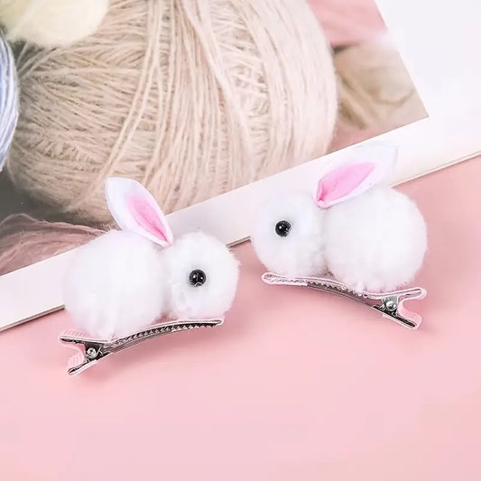 4 Small Easter Bunny Gifts And Accessories, Including Headbands And Hair Clips in White.